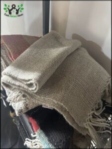 a close up of a pile of blankets on a chair