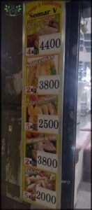 arafed sign in a store window advertising a variety of foods