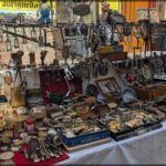 araffe stall with various items on a table in a market