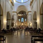 araful looking view of a church with a large ceiling and a large altar