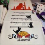 several different types of cards are on a table with a cat