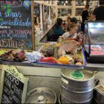 there are many different types of food on display at a market