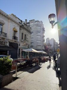 there are many people walking down the street in the city