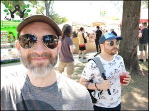 there are two men standing next to each other at a market