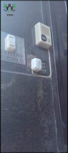 there is a black door with a bunch of electrical outlets on it