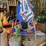 there is a blue chair with a blue and white striped cover