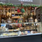 there is a display case with various types of cheeses in it