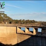 there is a large concrete bridge over a body of water