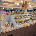 A candy store with a large display of candy.