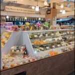 A candy store with a large display of candy.