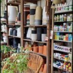 A store with a variety of pots and bottles on display.