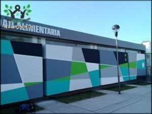 arafed building with a sign that says ada alimentaria
