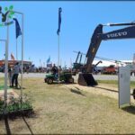there are a lot of tractors that are parked in the grass