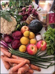 there are many different fruits and vegetables on the table