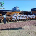 there are many tractors that are parked in the dirt