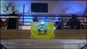there is a banner that says headphones on it hanging from a balcony