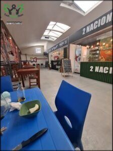 there is a blue table with a plate of food on it