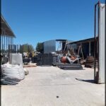 there is a large building with a lot of junk in the yard