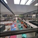 there is a large room with a lot of tables and chairs