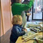 there is a woman and a child that are making food