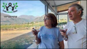 they are enjoying a glass of wine on the patio