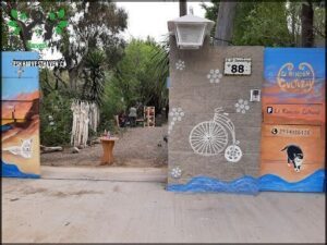 A bicycle is painted on the side of a building.