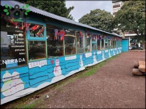 A blue building with a snowman painted on the side.