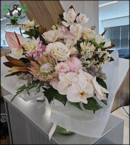 A bouquet of flowers is displayed in a vase.