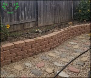 A brick wall with a power cord running through it.