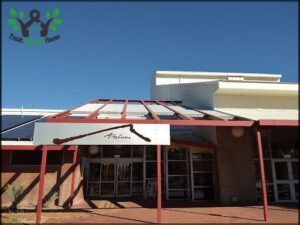 A building with a red roof and a sign that says "Falcon" on it.