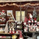 A Christmas display with various ornaments and decorations, including a Santa Claus figure.