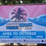 A colorful advertisement for the Mindil Beach Sunset Market.