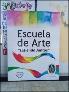 A colorful sign advertises an art class.