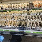 A display case filled with various types of sushi.