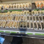 A display case filled with various types of sushi.