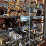 A display of teddy bears and chocolates in a store.