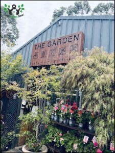 A garden store with a sign that says "The Garden".