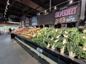 A large display of vegetables in a grocery store.