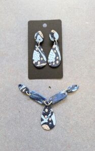 A pair of earrings with a tag on them.