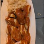 A plate of food with a sauce on it.
