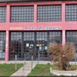 A red building with the name Vivero Los Leones written on it.