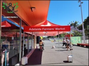 A red tent with the words "Adelaide Farmers' Market" written on it.