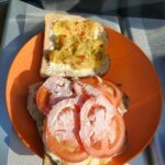 A sandwich with tomato and cheese on a plate.