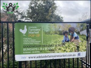 A sign advertising a farmers market pop-up event.