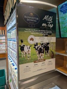 A sign advertising milk on tap.