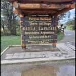 A sign in a park with the words "Parque Nacional Bahia Lapataia" written on it.