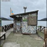 A small building with a lot of stickers on it.