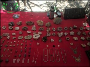 A table full of rocks and jewelry.