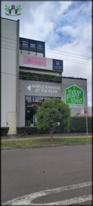 Amp Parking at the rear sign is displayed on the side of a building.