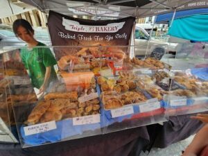 A bakery display with a variety of freshly baked goods.